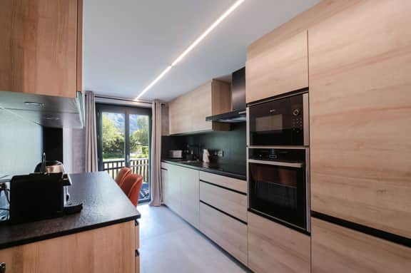 Modern Chalet Overlooking Alpine Mountain Peaks