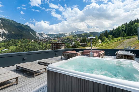 Elegant Ski Escape With Outdoor Jacuzzi - Image 2